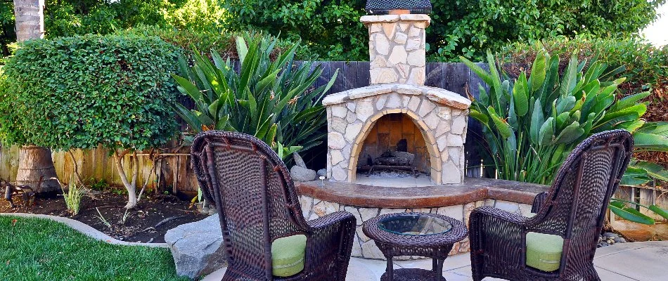 Property in Boston, MA, with an outdoor fireplace.