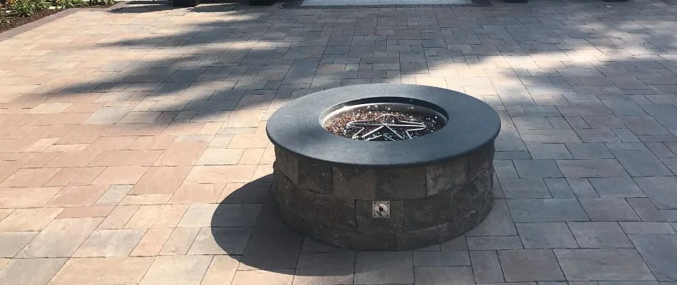Paver patio in Burlington, MA, with a fire pit.