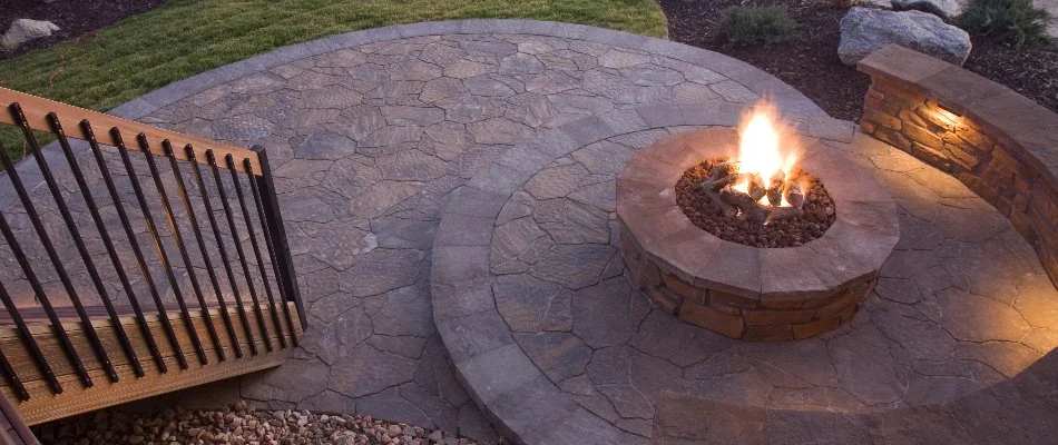 Patio area with fire pit on a property in Boston, MA.