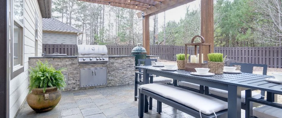 Outdoor kitchen with grill on a property in Boston, MA.