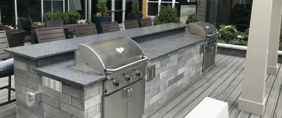 Outdoor kitchen with two grills in Boston, MA.