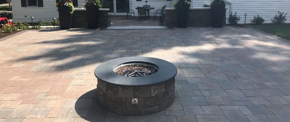 Patio and round fire pit in Lexington, MA.