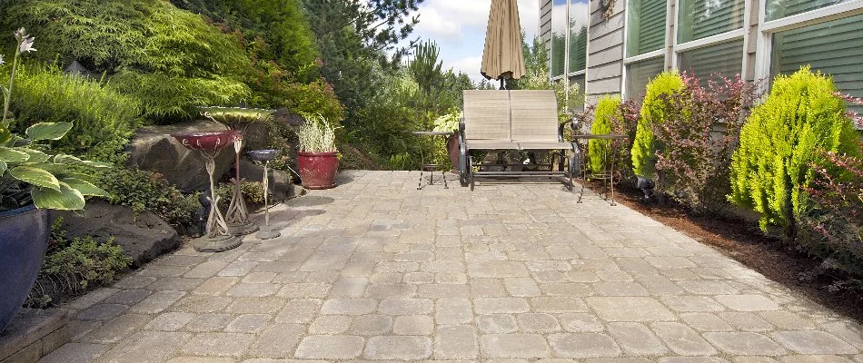Patio area with plants on each side on a property in Boston, MA.