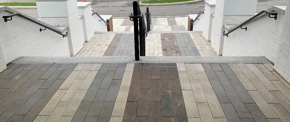 Paver steps and a white retaining wall in Boston, MA.