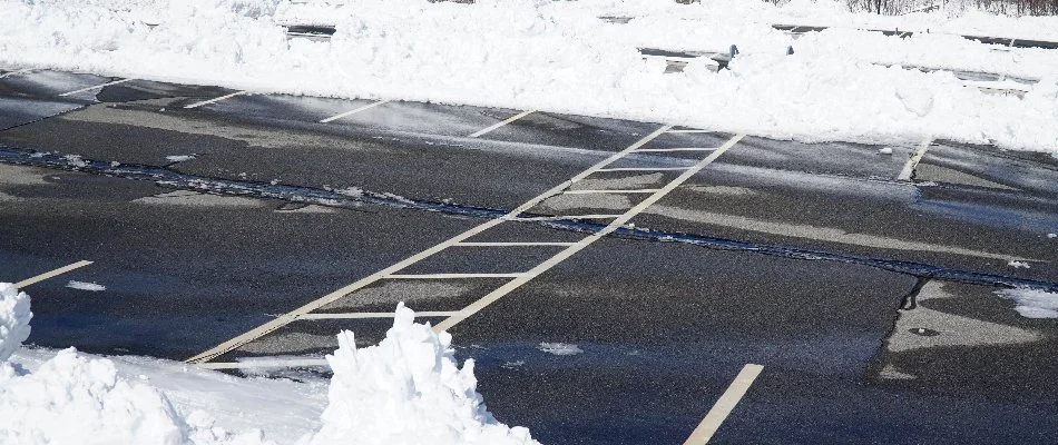 Snow pushed to the side of a parking lot in Boston, MA.