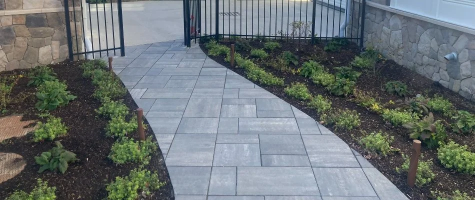 Walkway and mulched landscape beds in Nashua, NH.